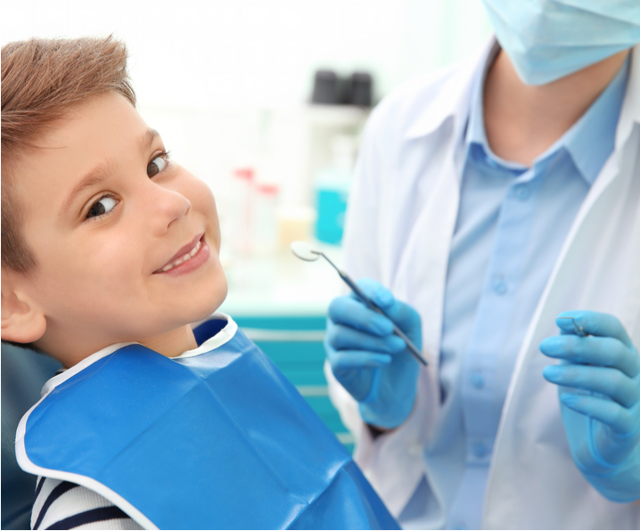 boy smiling at dentist office